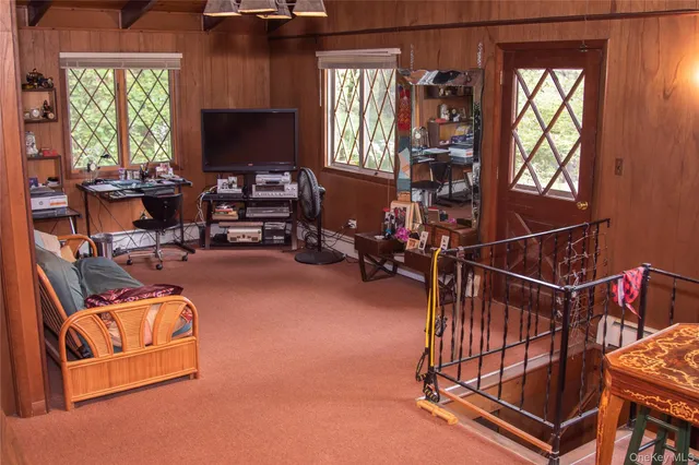 a room with gym equipment and a large window