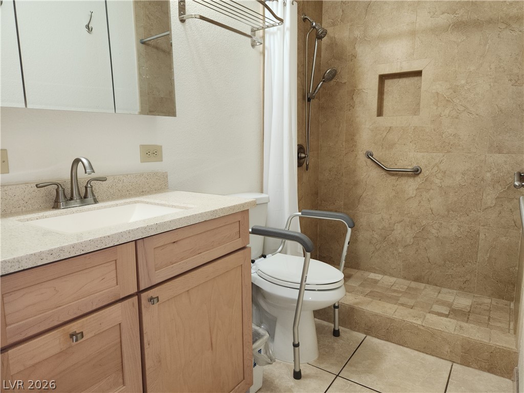2016 Mesquite Lane, Unit 104 Laughlin, NV 89029 - Photo 13 of 27 Hall Bath with updated vanity, cabinets with walk-in shower
