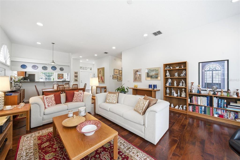 5452 Endicott Place Oviedo, FL 32765 - Photo 11 of 38 a living room with furniture and a wooden floor