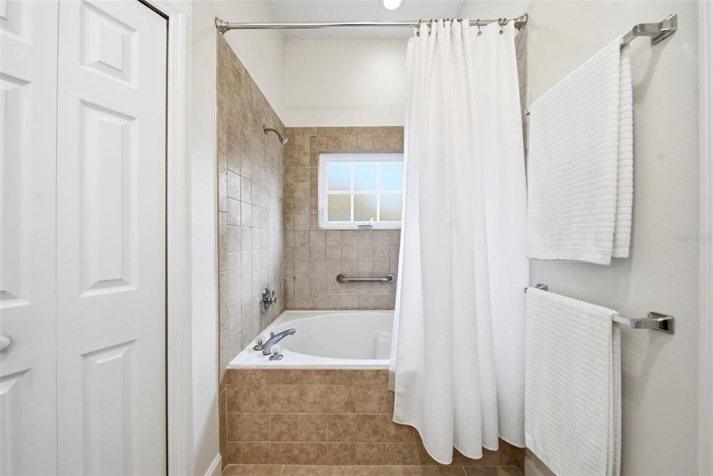 5452 Endicott Place Oviedo, FL 32765 - Photo 18 of 38 a bathroom with a granite countertop sink and a mirror