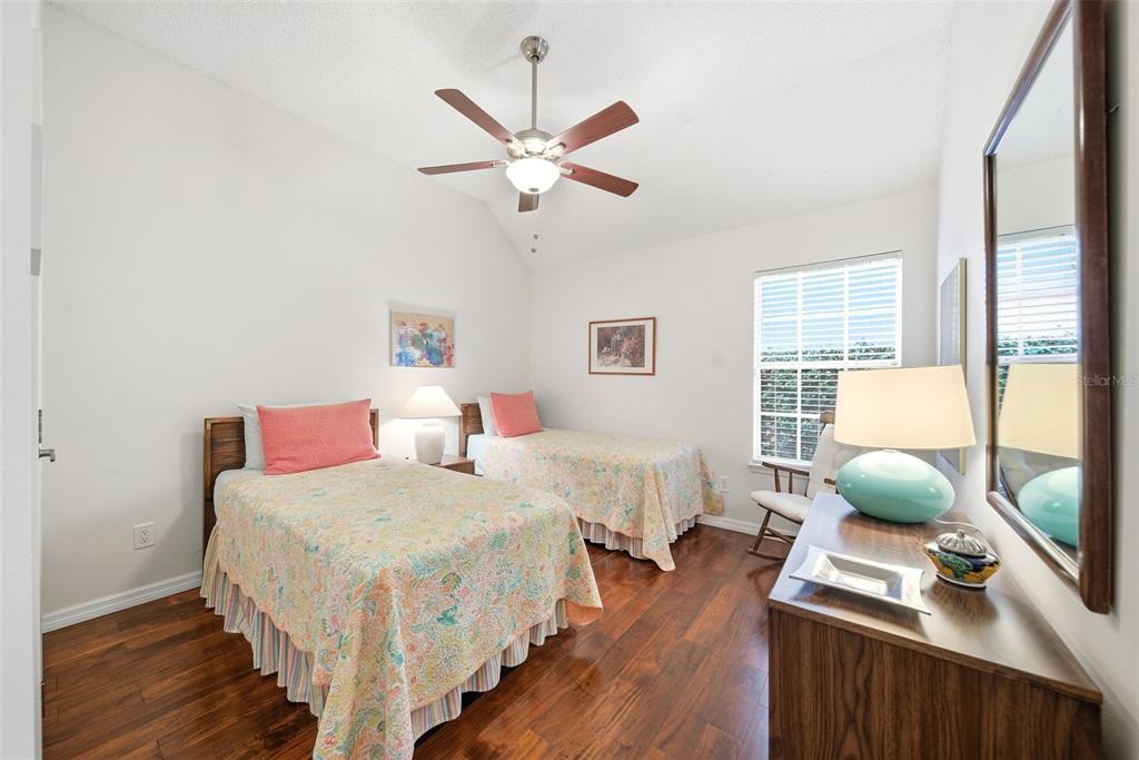 5452 Endicott Place Oviedo, FL 32765 - Photo 19 of 38 a bedroom with two beds and a window