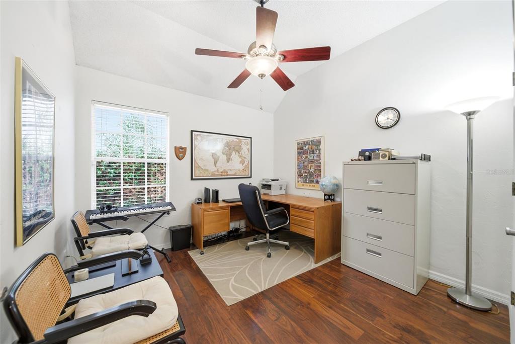 5452 Endicott Place Oviedo, FL 32765 - Photo 20 of 38 a workspace with wooden floor