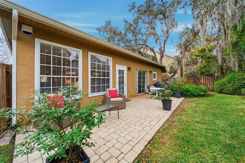 5452 Endicott Place Oviedo, FL 32765 - Photo 24 of 38 a house with a flower garden in front of it