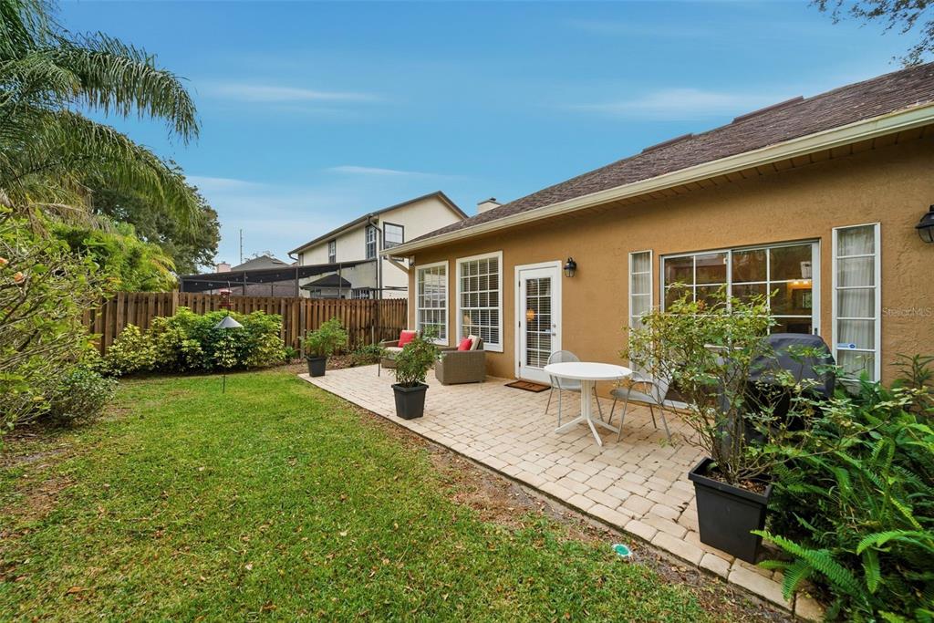 5452 Endicott Place Oviedo, FL 32765 - Photo 26 of 38 a view of a house with backyard sitting area and garden
