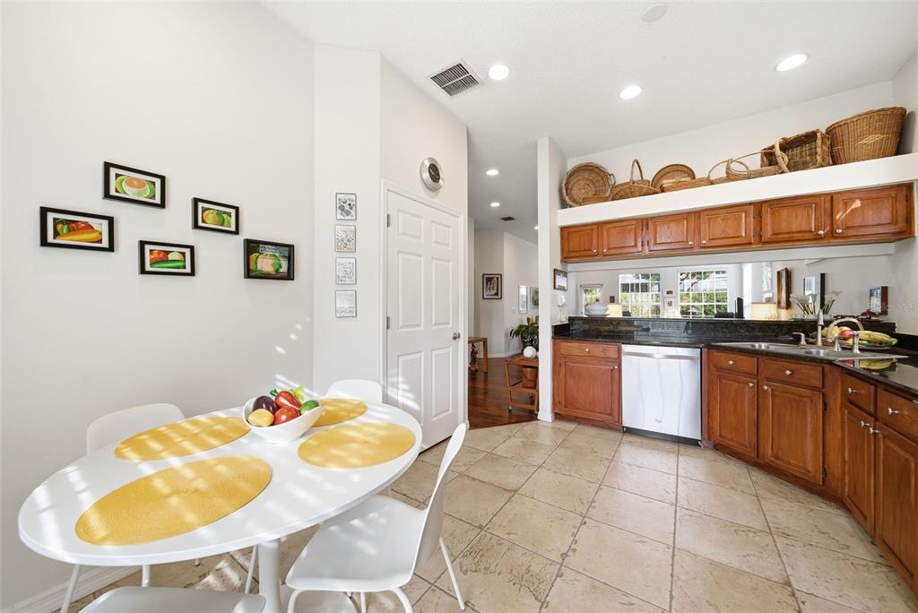 5452 Endicott Place Oviedo, FL 32765 - Photo 7 of 38 a kitchen with stainless steel appliances granite countertop a sink and cabinets