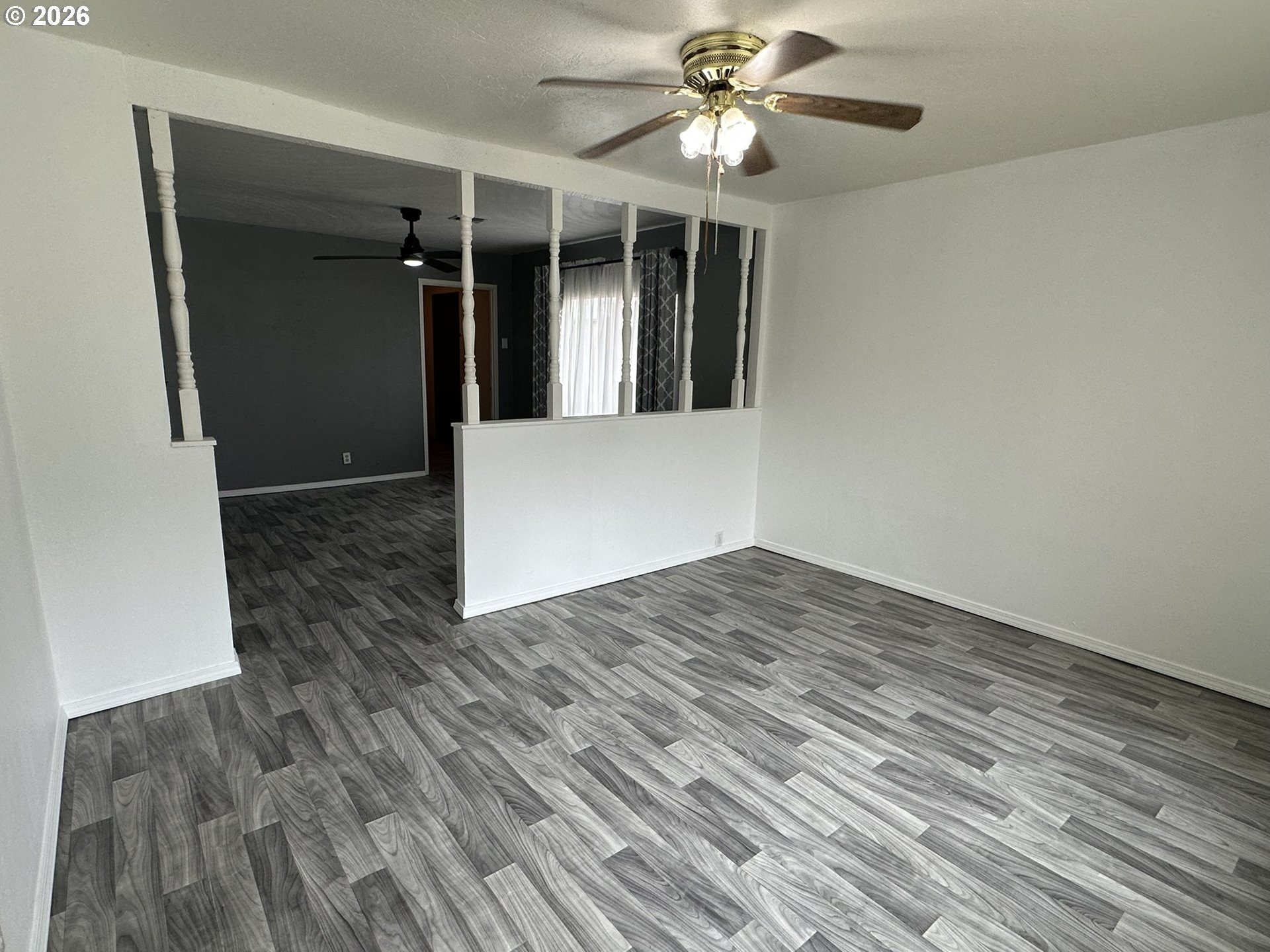 101 Southwest Peach Lane Winston, OR 97496 - Photo 11 of 22 a view of empty room with wooden floor