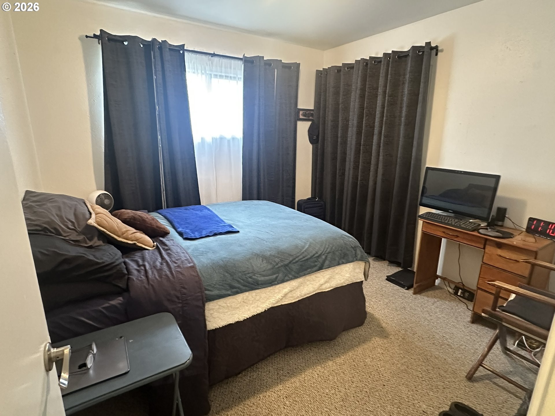 101 Southwest Peach Lane Winston, OR 97496 - Photo 13 of 22 a bedroom with a bed and a window