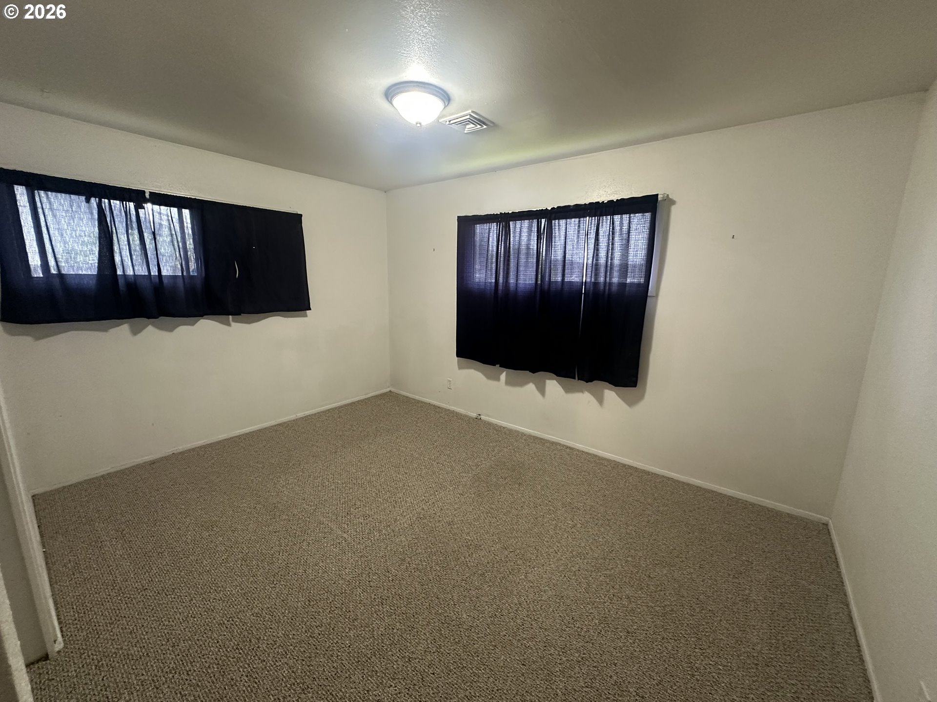 101 Southwest Peach Lane Winston, OR 97496 - Photo 14 of 22 a view of an empty room with wooden floor and cabinet