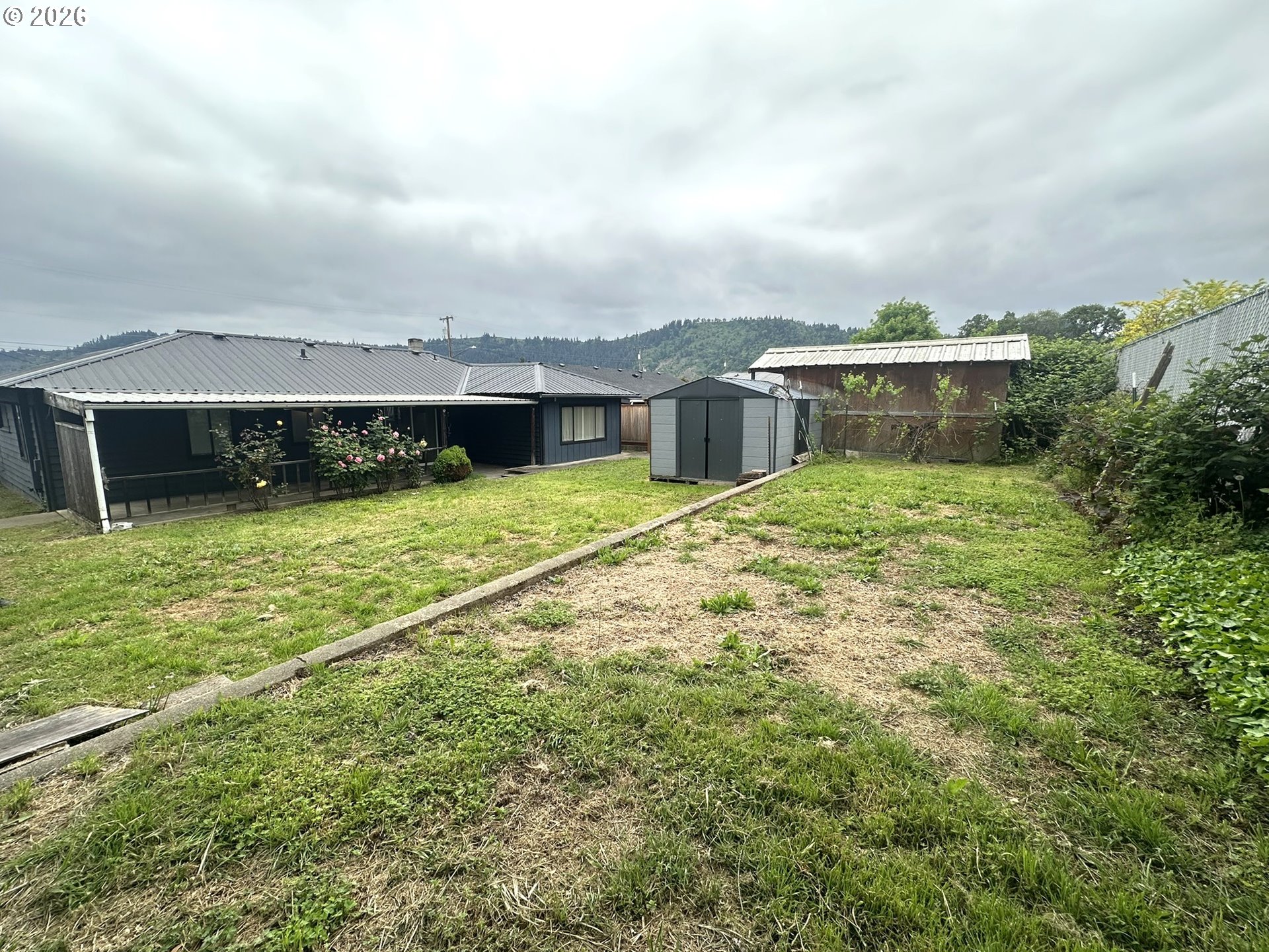 101 Southwest Peach Lane Winston, OR 97496 - Photo 18 of 22 a view of a house with a yard