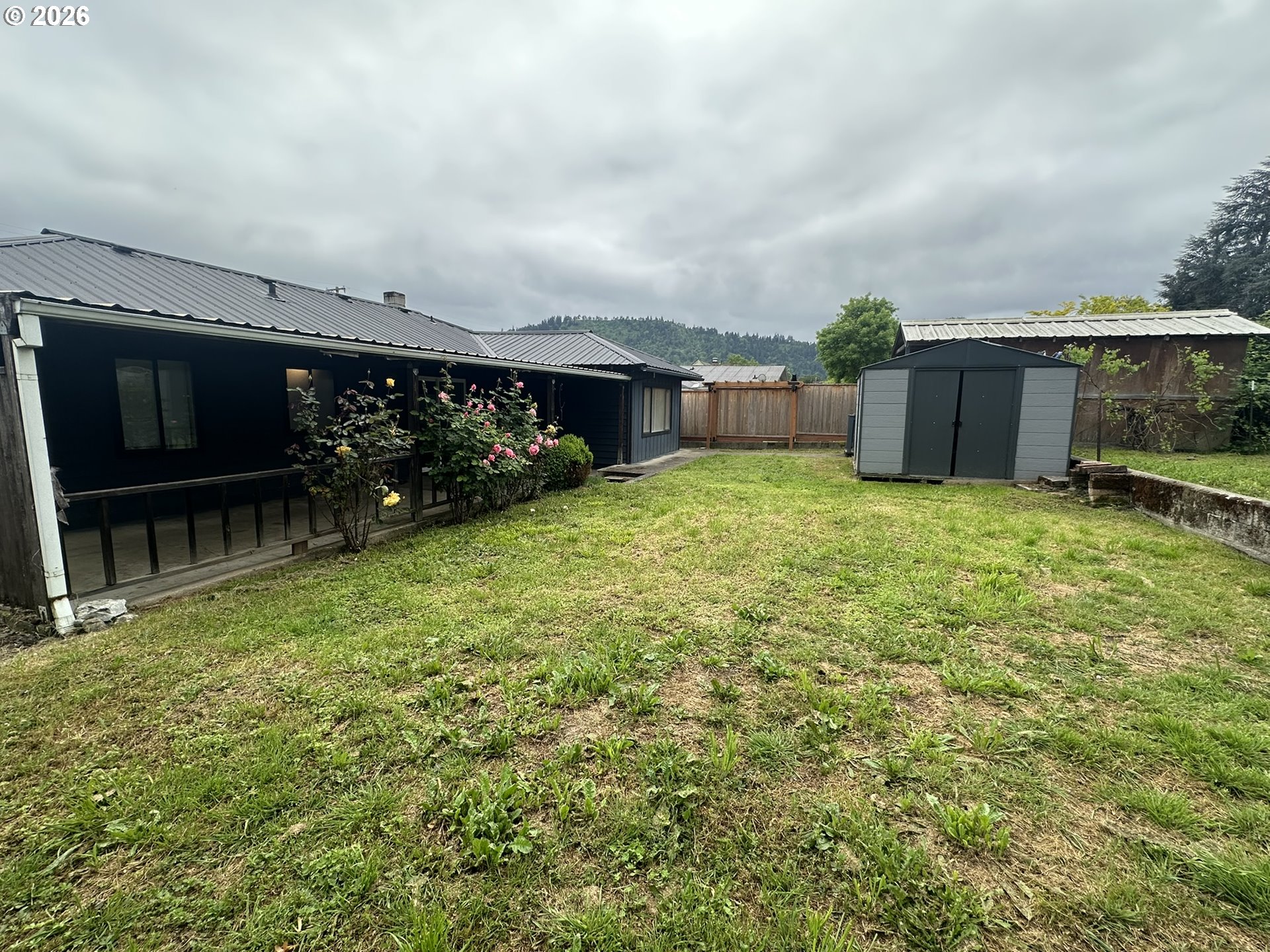 101 Southwest Peach Lane Winston, OR 97496 - Photo 20 of 22 view of house with yard and entertaining space
