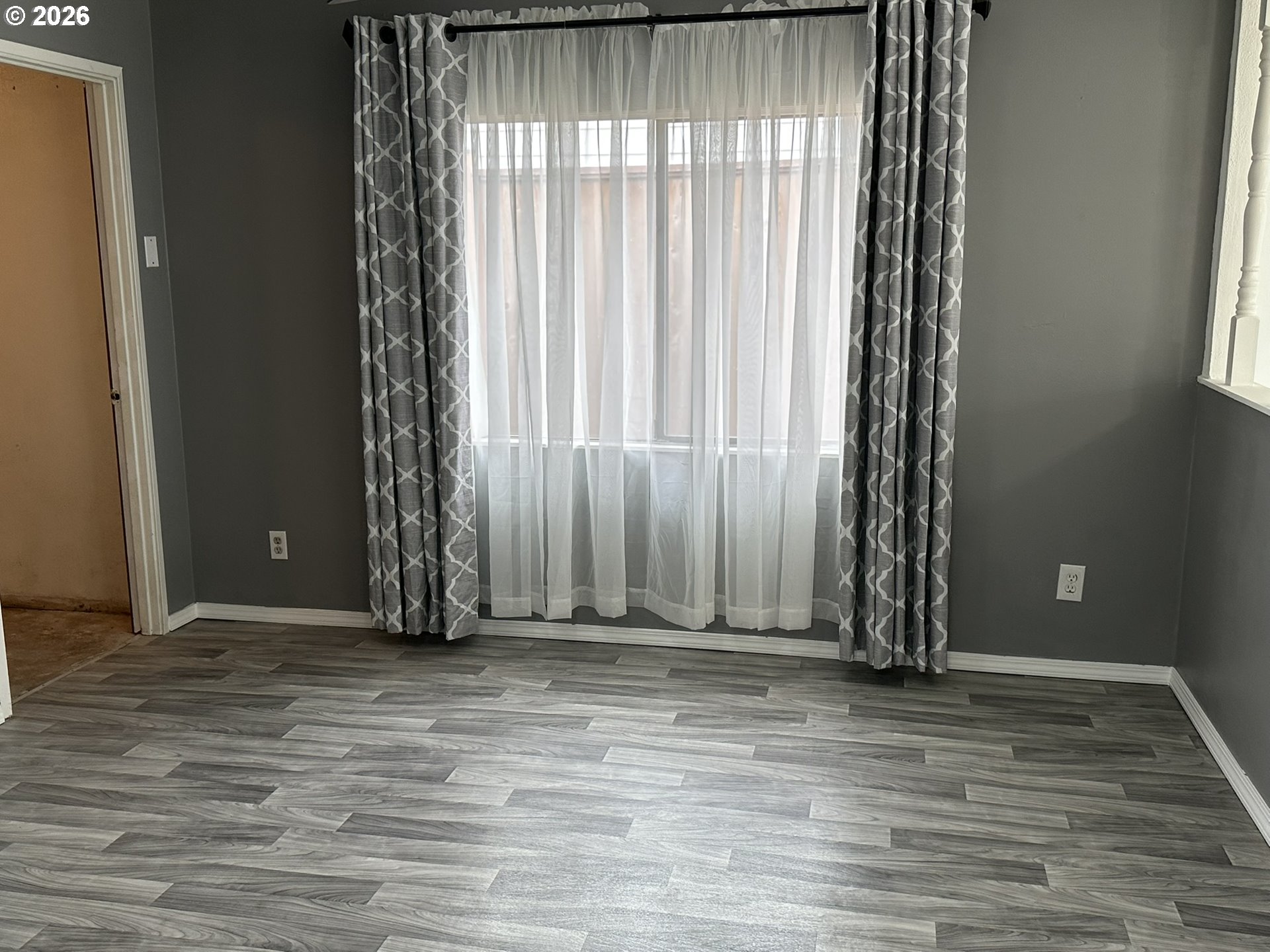 101 Southwest Peach Lane Winston, OR 97496 - Photo 3 of 22 a view of a room with wooden floor and a window