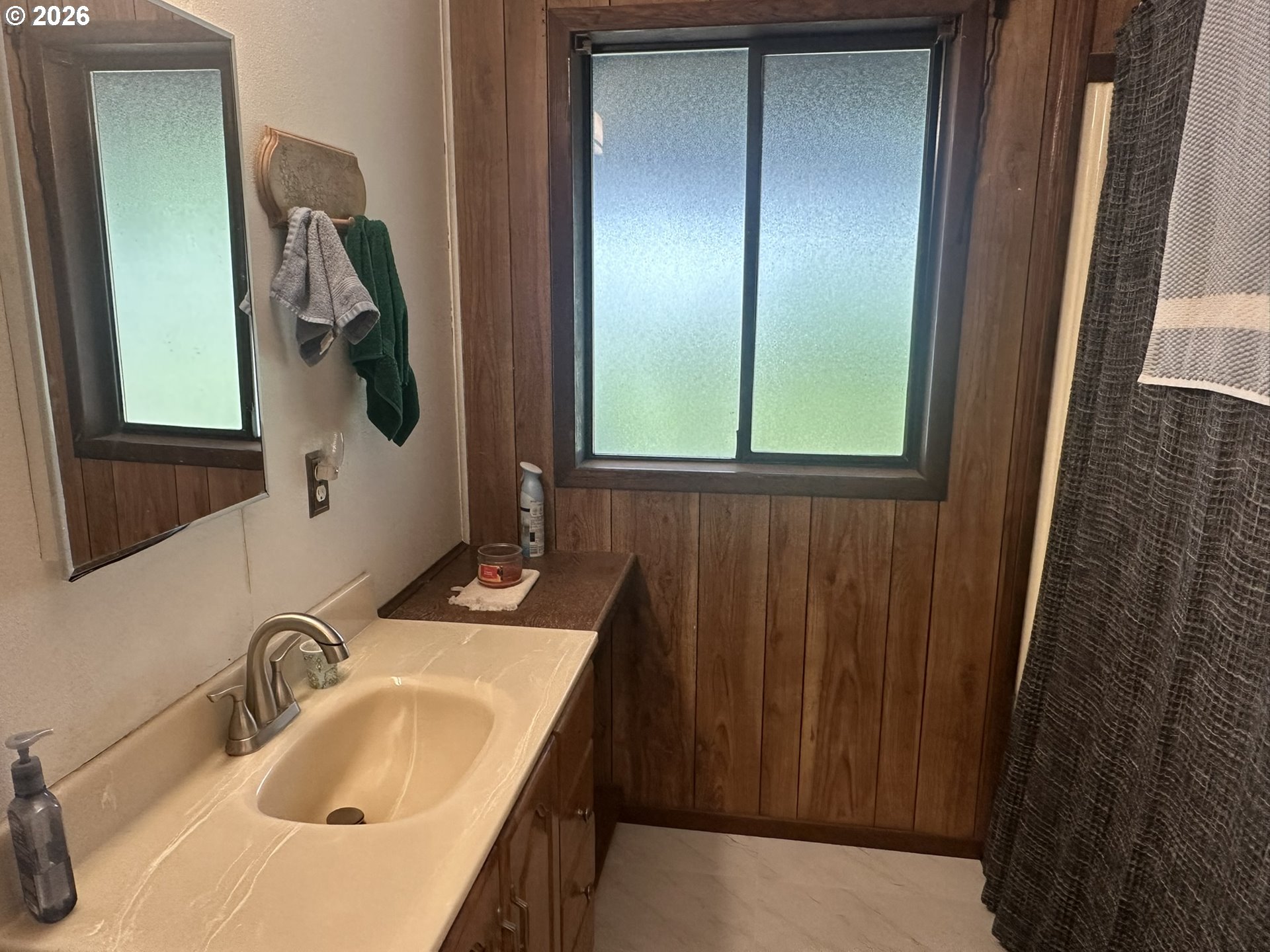 101 Southwest Peach Lane Winston, OR 97496 - Photo 8 of 22 a bathroom with a sink and mirror