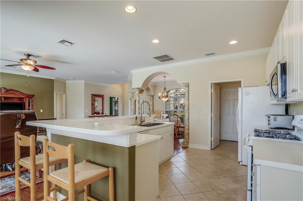9971 Rookery Circle Estero, FL 33928 - Photo 14 of 36 View from Great Room to Kitchen