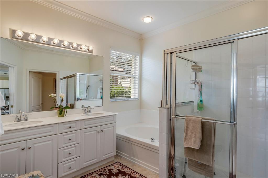 9971 Rookery Circle Estero, FL 33928 - Photo 19 of 36 Owner's Bathroom has separate w.c.