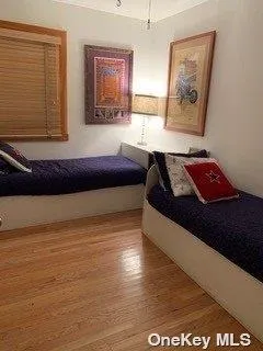 a bedroom with a bed and dresser