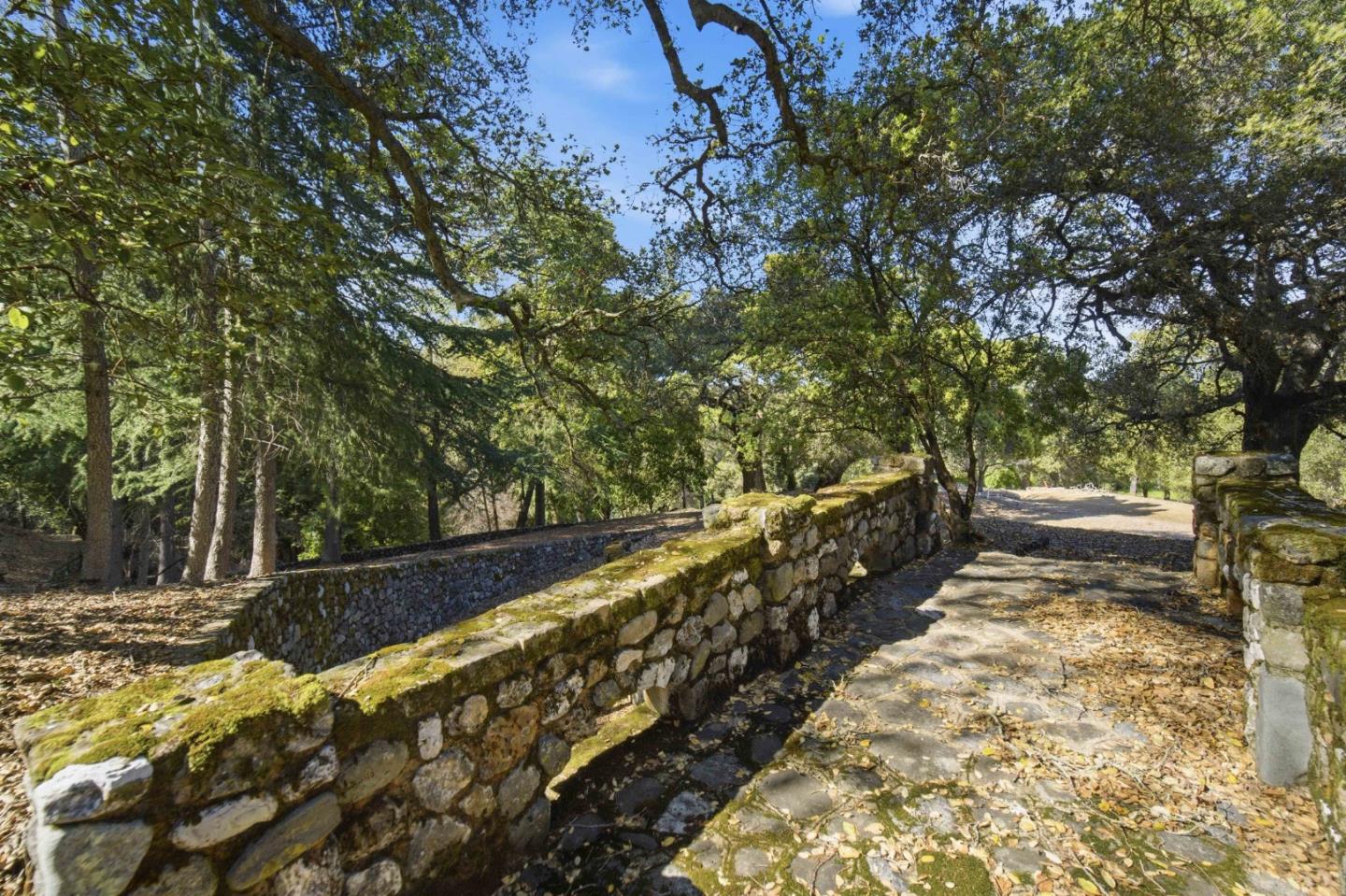 15400 Madrone Hill Road Saratoga, CA 95070 - Photo 22 of 32 a view of a yard with wooden fence