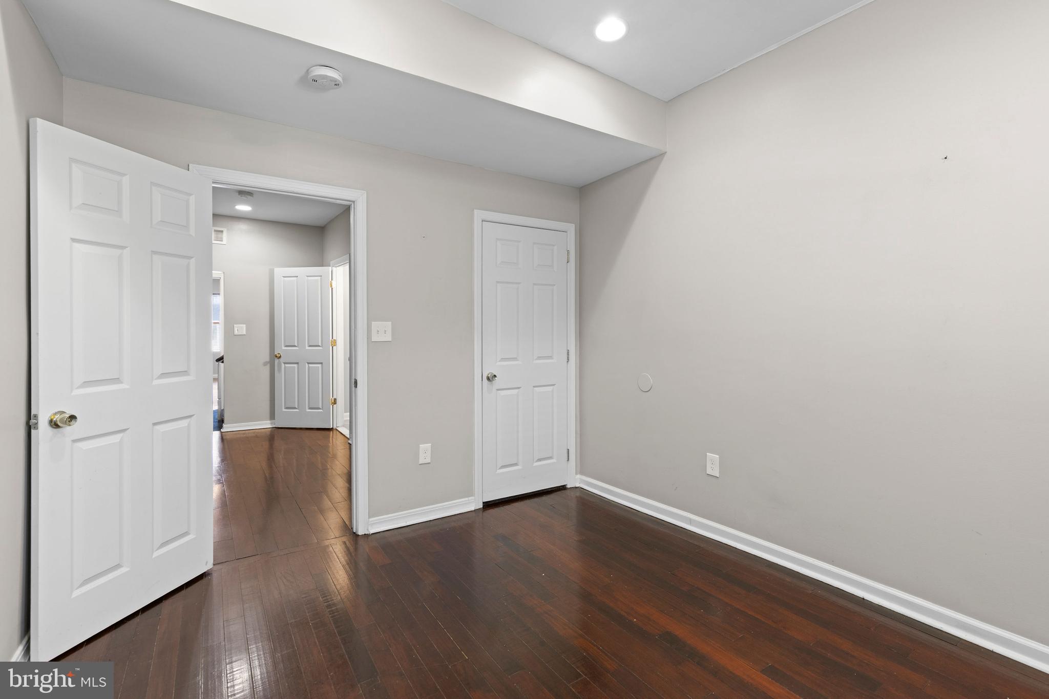 206 South Gilmor Street Baltimore, MD 21223 - Photo 17 of 27 a view of an empty room with wooden floor
