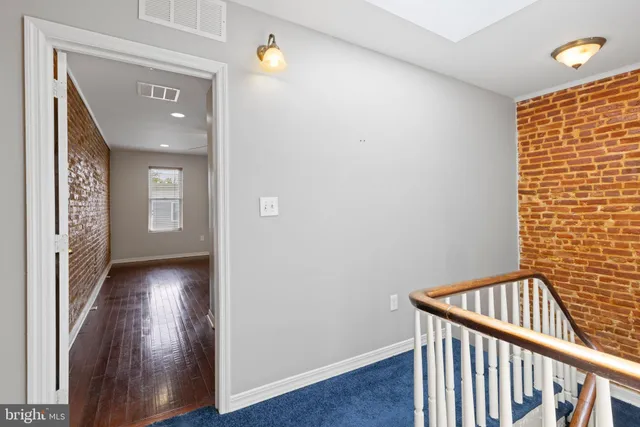 a view of entryway with wooden floor