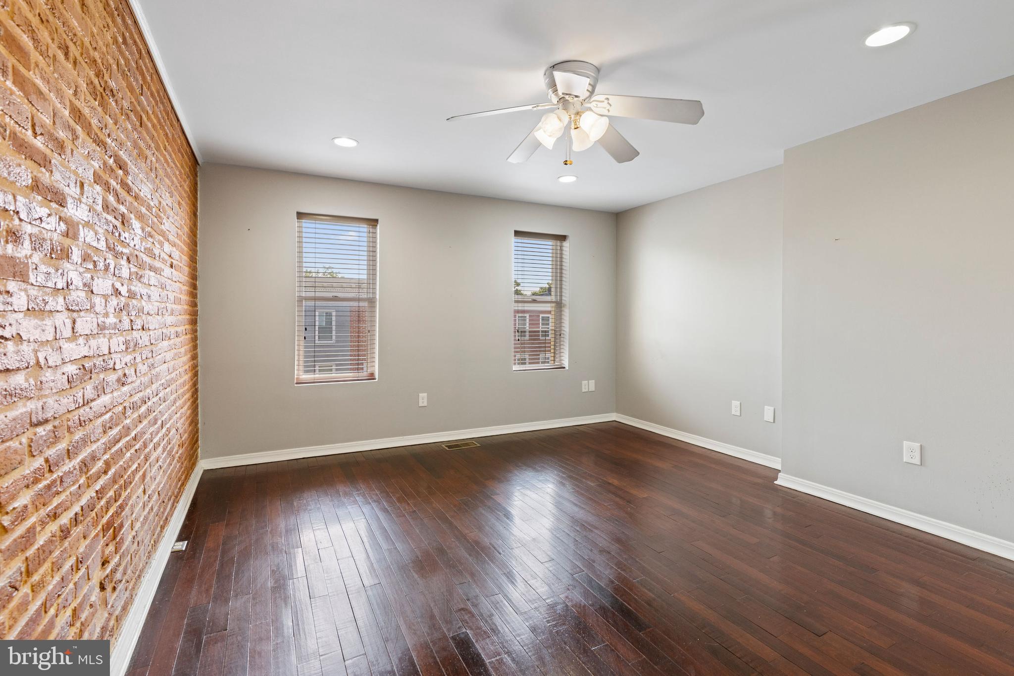 206 South Gilmor Street Baltimore, MD 21223 - Photo 20 of 27 wooden floor in an empty room with a window