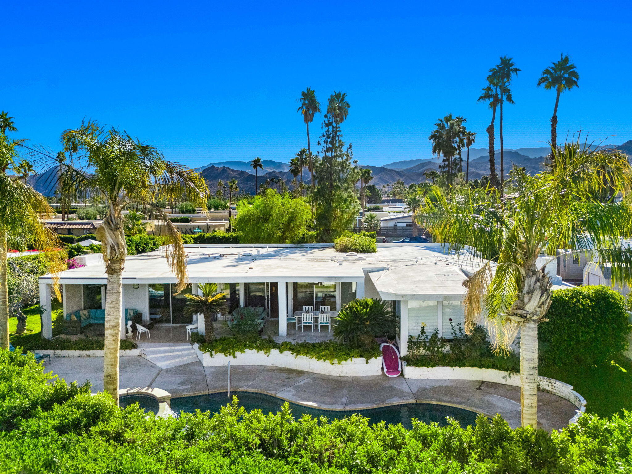 72890 Homestead Road Palm Desert, CA 92260 - Photo 1 of 45 a front view of a house with a yard