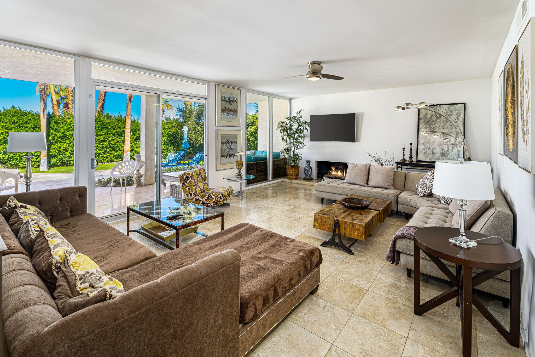 72890 Homestead Road Palm Desert, CA 92260 - Photo 14 of 45 a living room with furniture and a large window