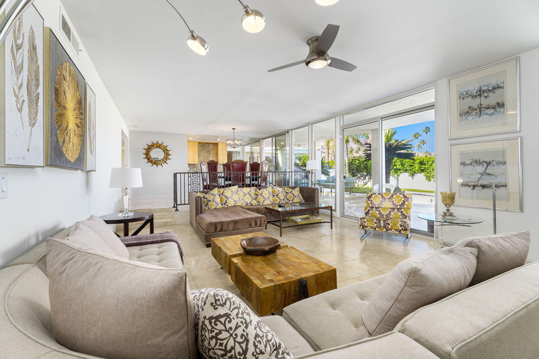 72890 Homestead Road Palm Desert, CA 92260 - Photo 16 of 45 a living room with furniture and a large window
