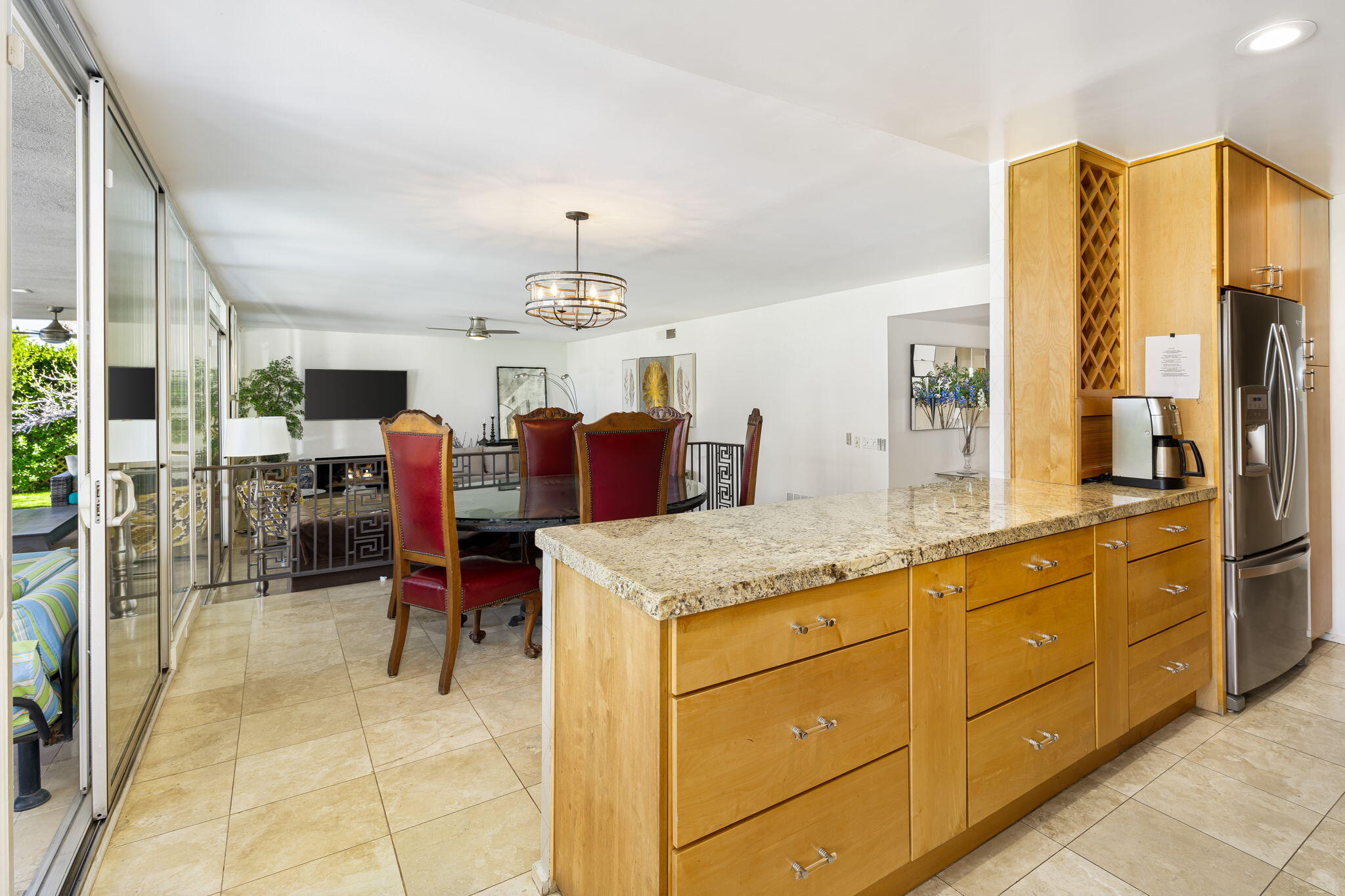 72890 Homestead Road Palm Desert, CA 92260 - Photo 19 of 45 a kitchen with stainless steel appliances granite countertop sink cabinets and wooden floor