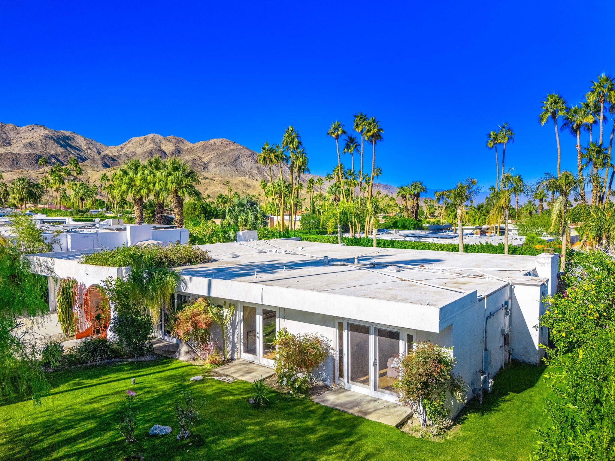 72890 Homestead Road Palm Desert, CA 92260 - Photo 2 of 45 a view of a house with a yard