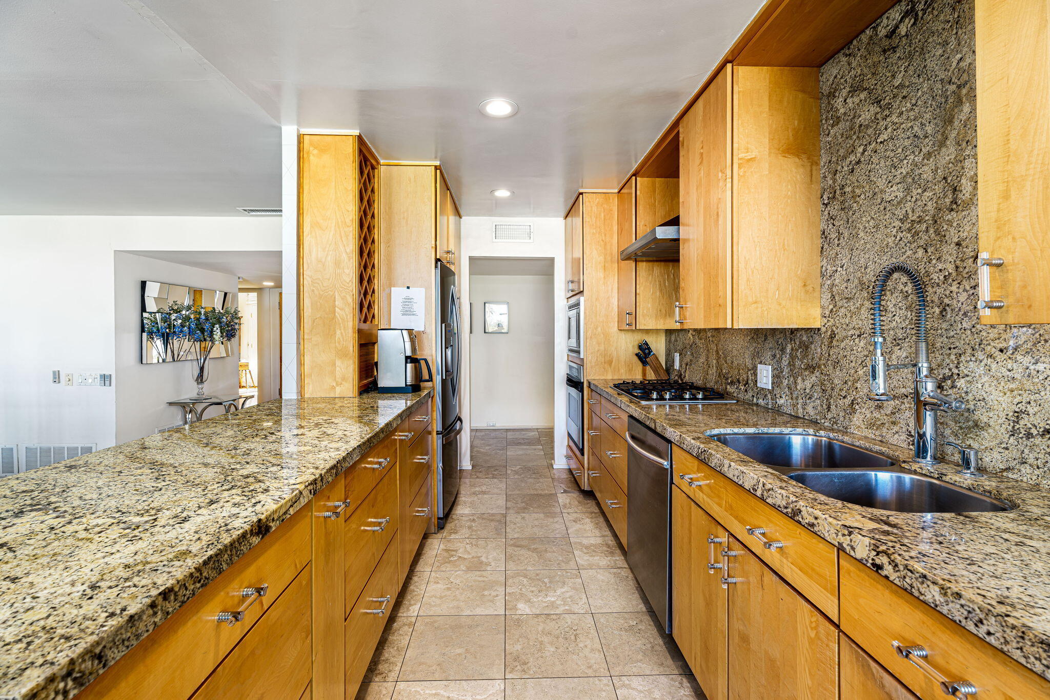 72890 Homestead Road Palm Desert, CA 92260 - Photo 21 of 45 a large kitchen with stainless steel appliances granite countertop a sink and counter space