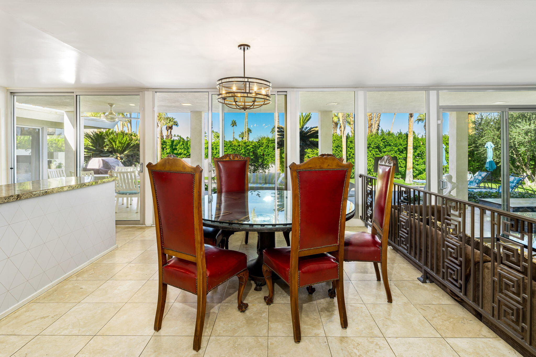 72890 Homestead Road Palm Desert, CA 92260 - Photo 22 of 45 a view of a dining room with furniture wooden floor and chandelier