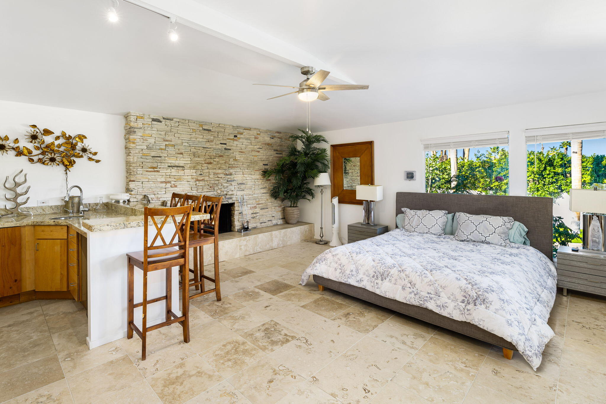 72890 Homestead Road Palm Desert, CA 92260 - Photo 30 of 45 a spacious bedroom with a bed and window