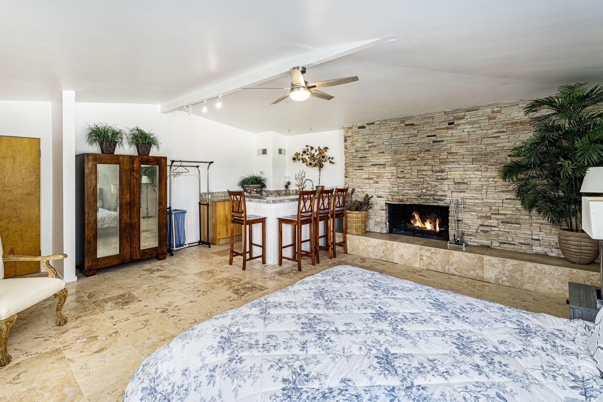 72890 Homestead Road Palm Desert, CA 92260 - Photo 31 of 45 a living room with furniture a fireplace and a ceiling fan