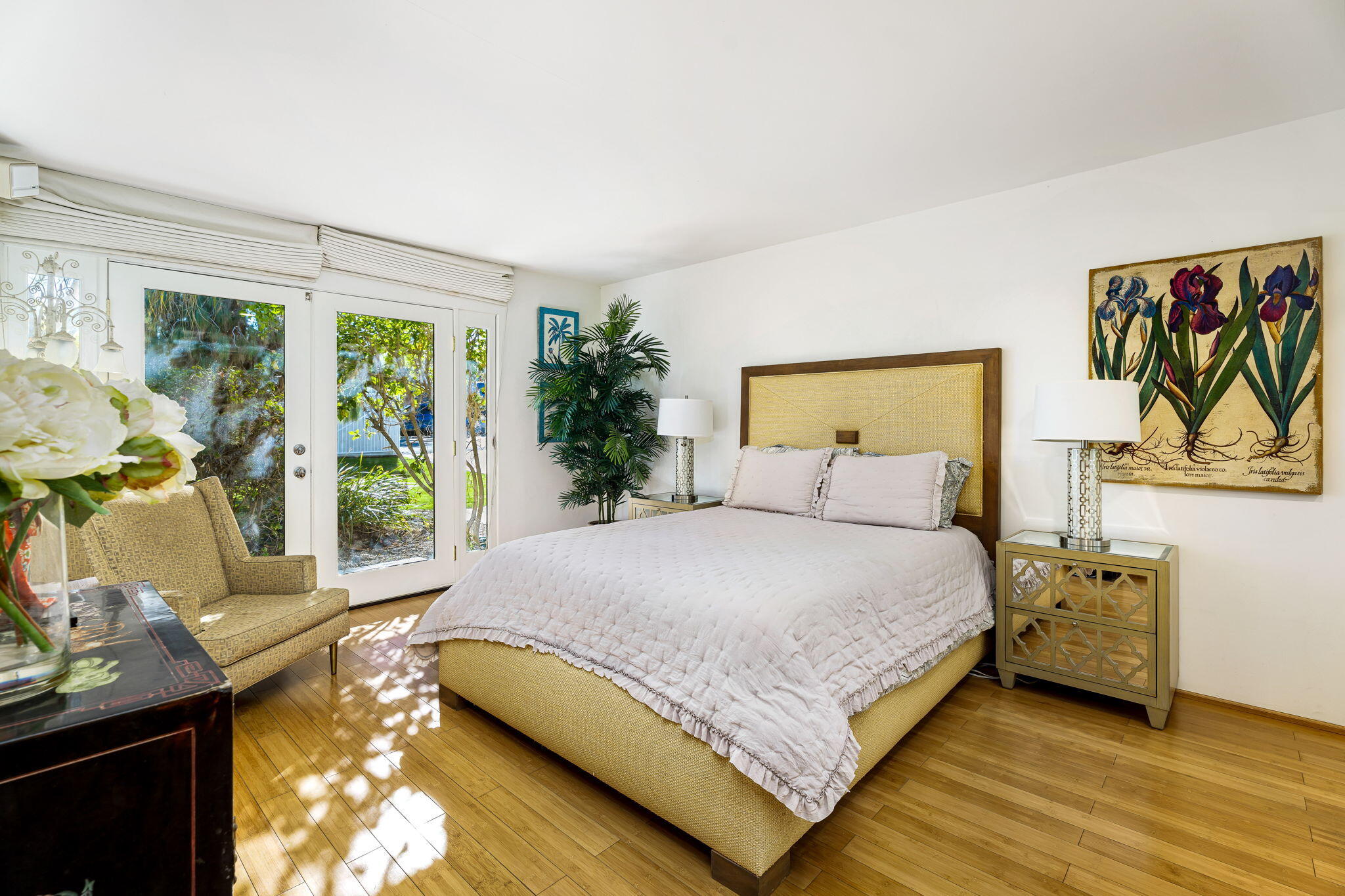 72890 Homestead Road Palm Desert, CA 92260 - Photo 35 of 45 a bedroom with a bed and large windows