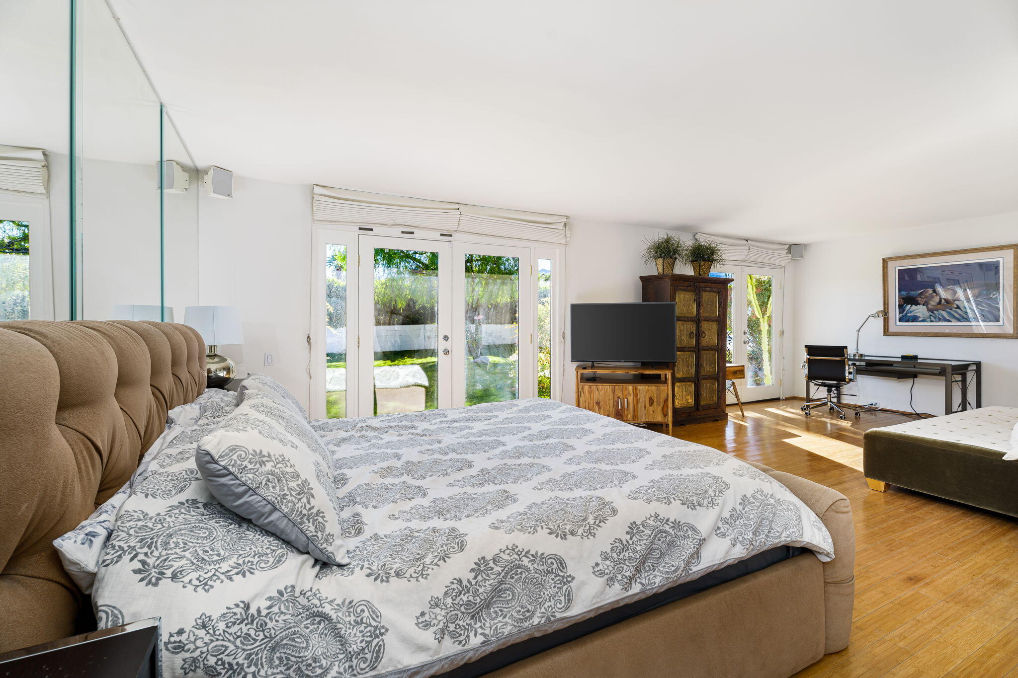 72890 Homestead Road Palm Desert, CA 92260 - Photo 36 of 45 a bedroom with a large bed and a flat tv screen