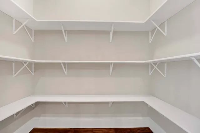 a view of an empty walk in closet