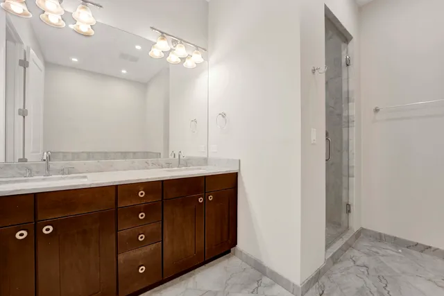 a bathroom with a glass shower door