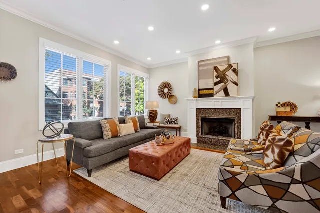 a living room with furniture and a fireplace