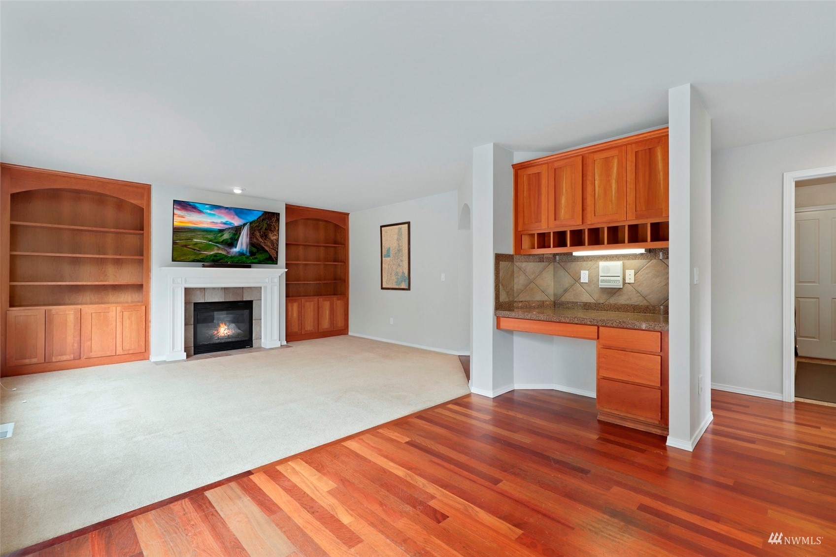4415 240 Place Southeast Bothell, WA 98021 - Photo 18 of 40 a view of a livingroom with wooden floor and a fireplace