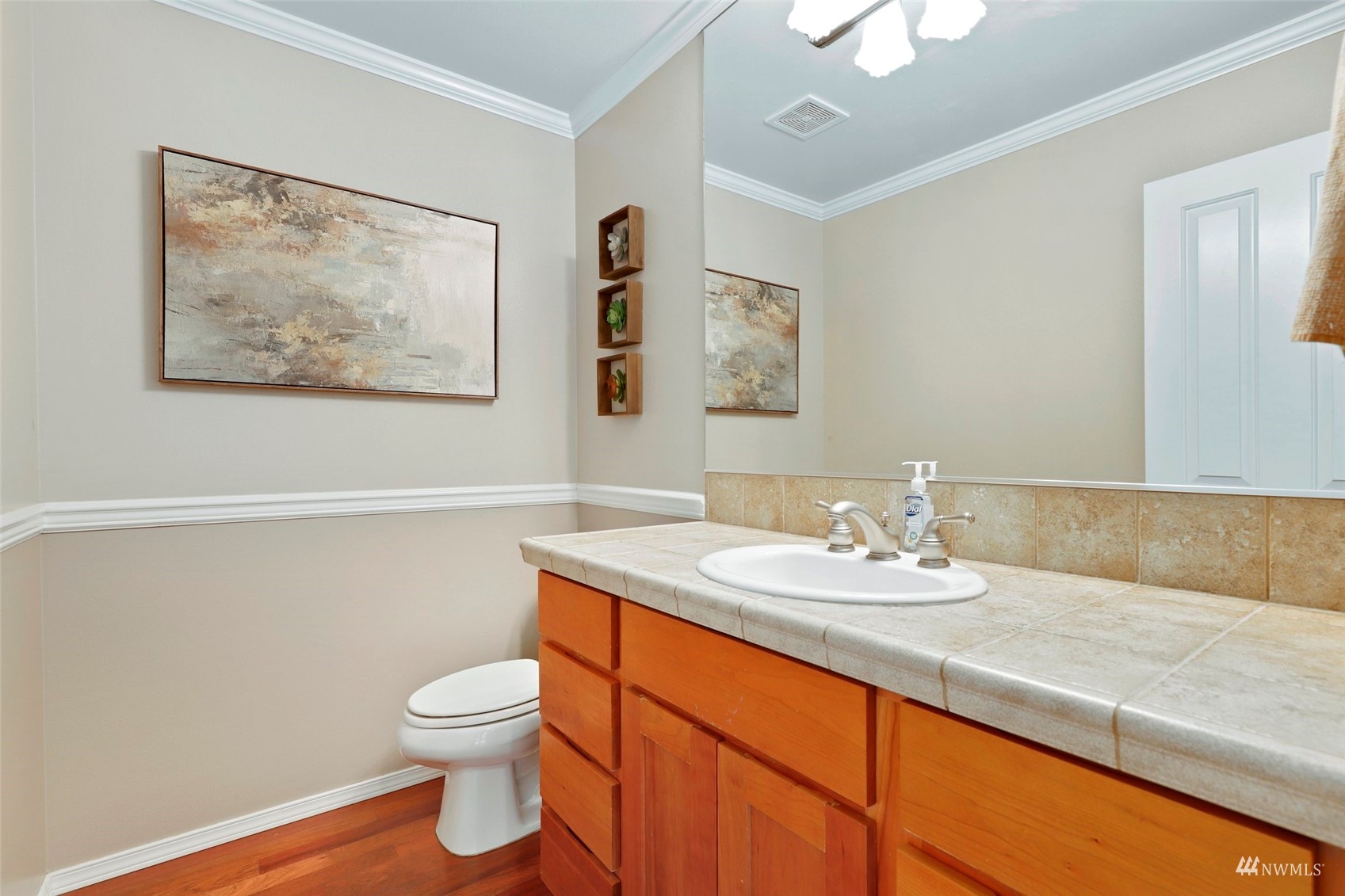 4415 240 Place Southeast Bothell, WA 98021 - Photo 21 of 40 a bathroom with a granite countertop sink a toilet and a mirror