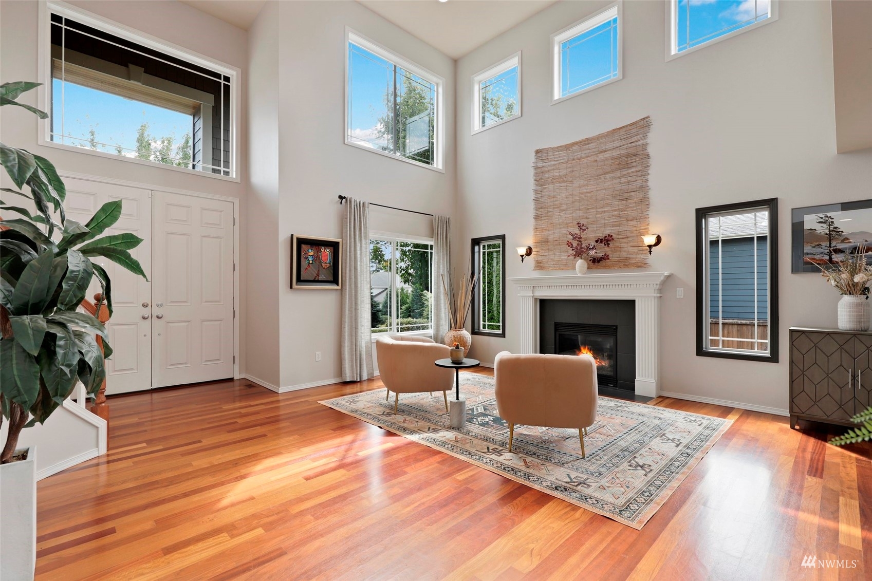 4415 240 Place Southeast Bothell, WA 98021 - Photo 8 of 40 a living room with furniture and a fireplace