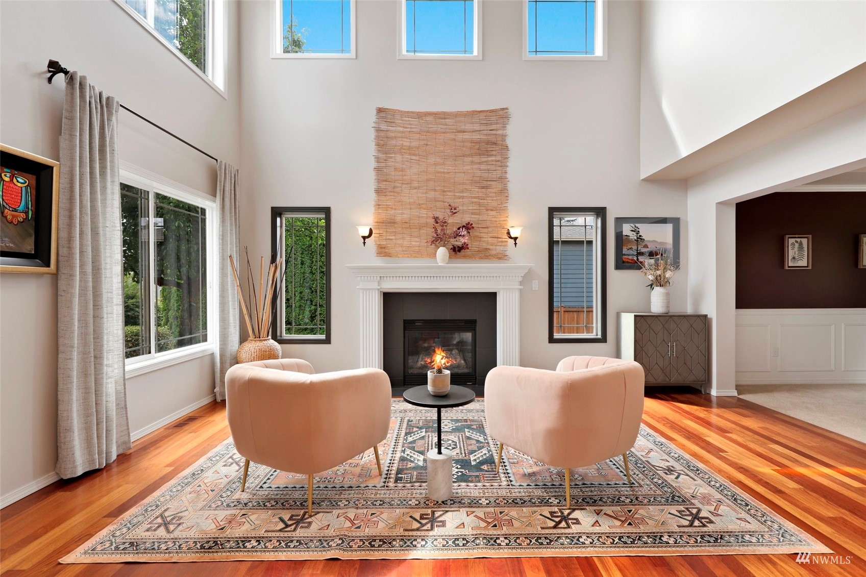 4415 240 Place Southeast Bothell, WA 98021 - Photo 9 of 40 a living room with furniture a rug and a fireplace