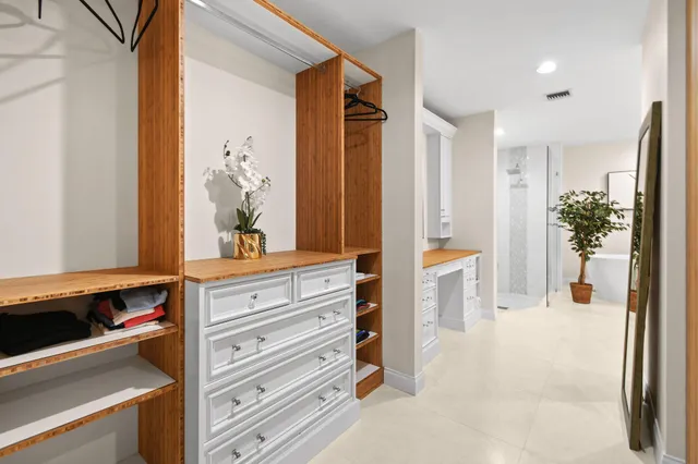 a bedroom with a bed and a chair