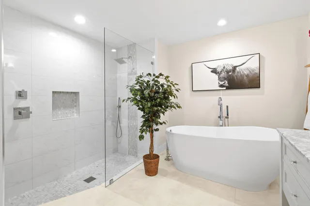 a bathroom with a sink a toilet and a shower