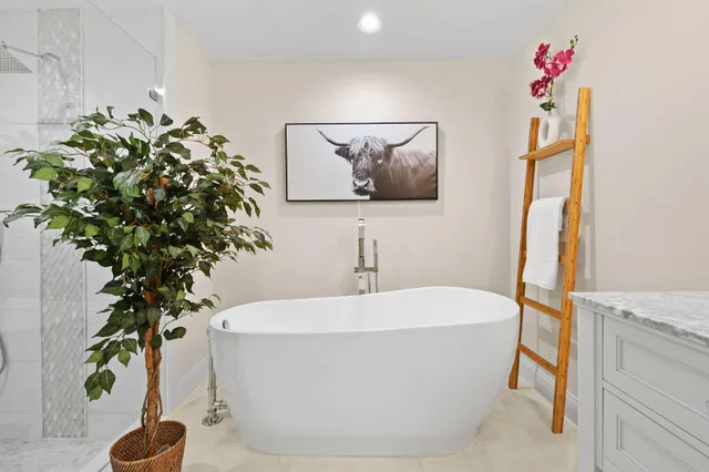 a white bath tub sitting in a bathroom
