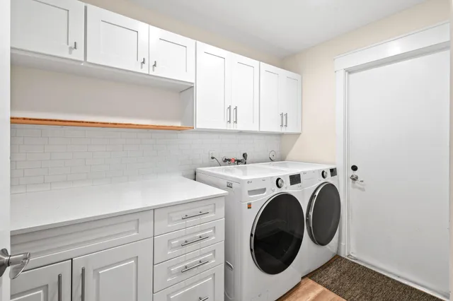 a utility room with dryer and washer
