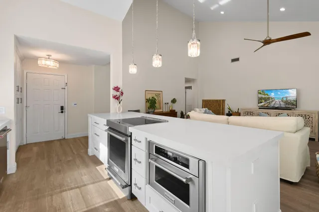 a kitchen with a stove and a refrigerator