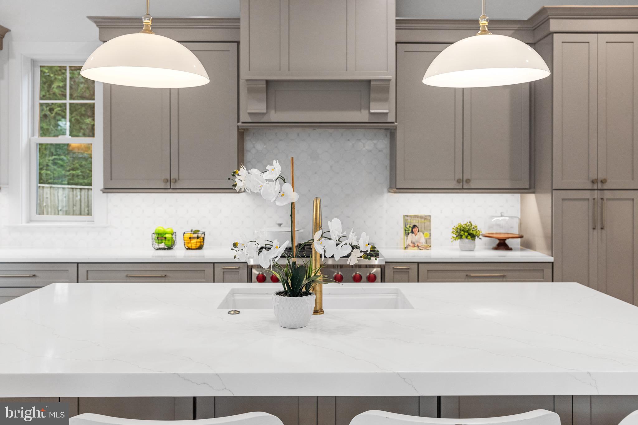 7804 Custer Road Bethesda, MD 20814 - Photo 24 of 68 a kitchen with a sink and a refrigerator