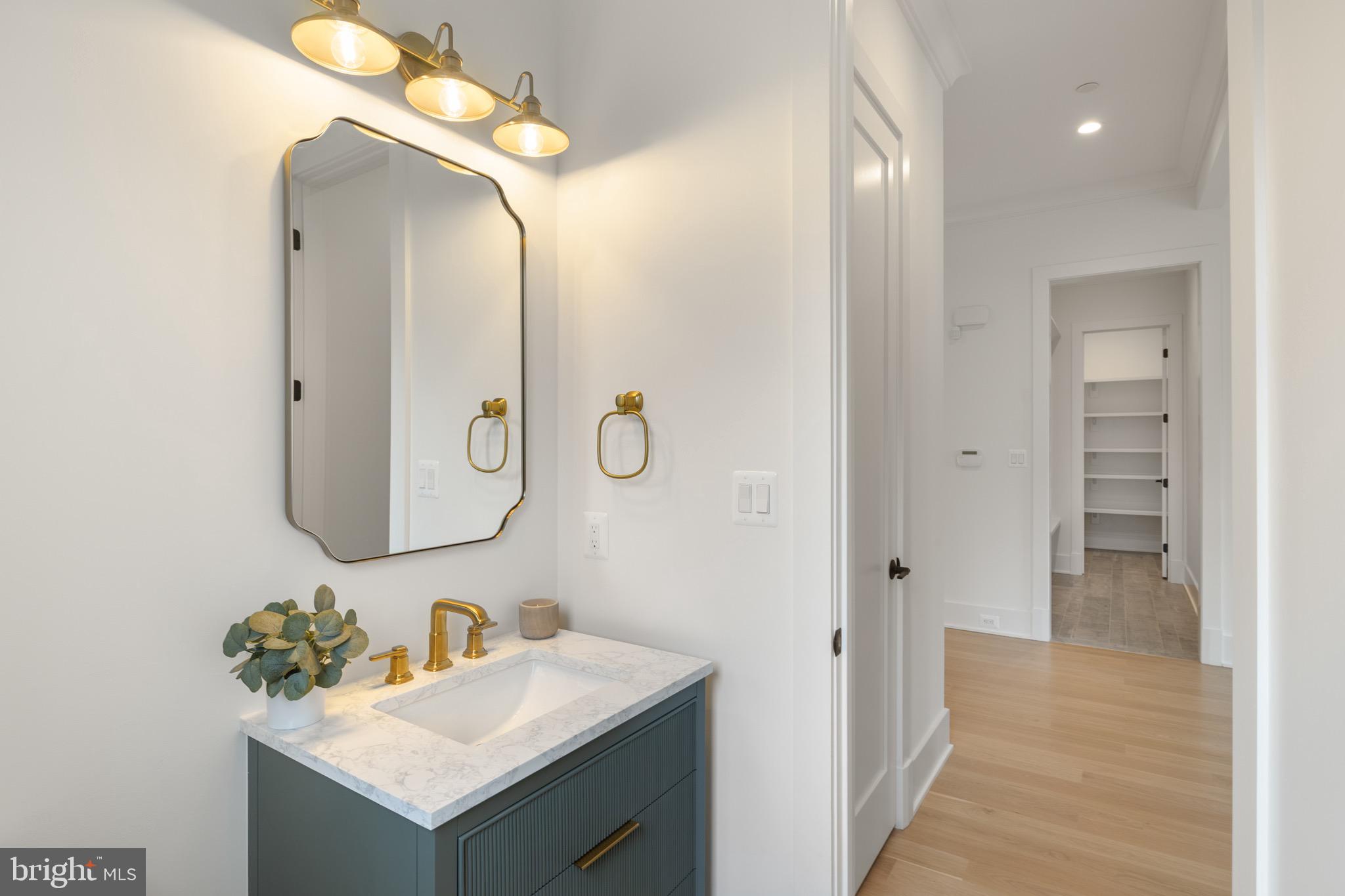 7804 Custer Road Bethesda, MD 20814 - Photo 33 of 68 a bathroom with a sink vanity and a mirror
