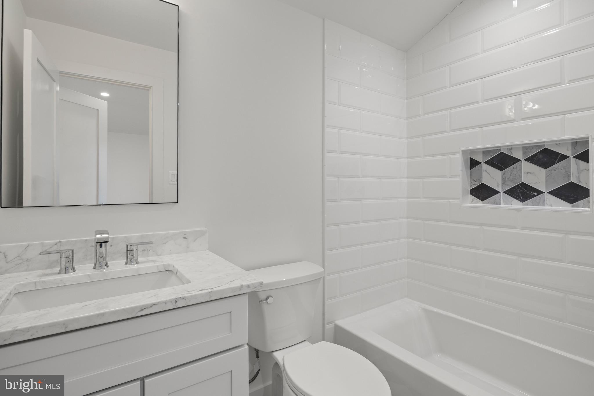 7804 Custer Road Bethesda, MD 20814 - Photo 53 of 68 a bathroom with a granite countertop sink toilet and shower