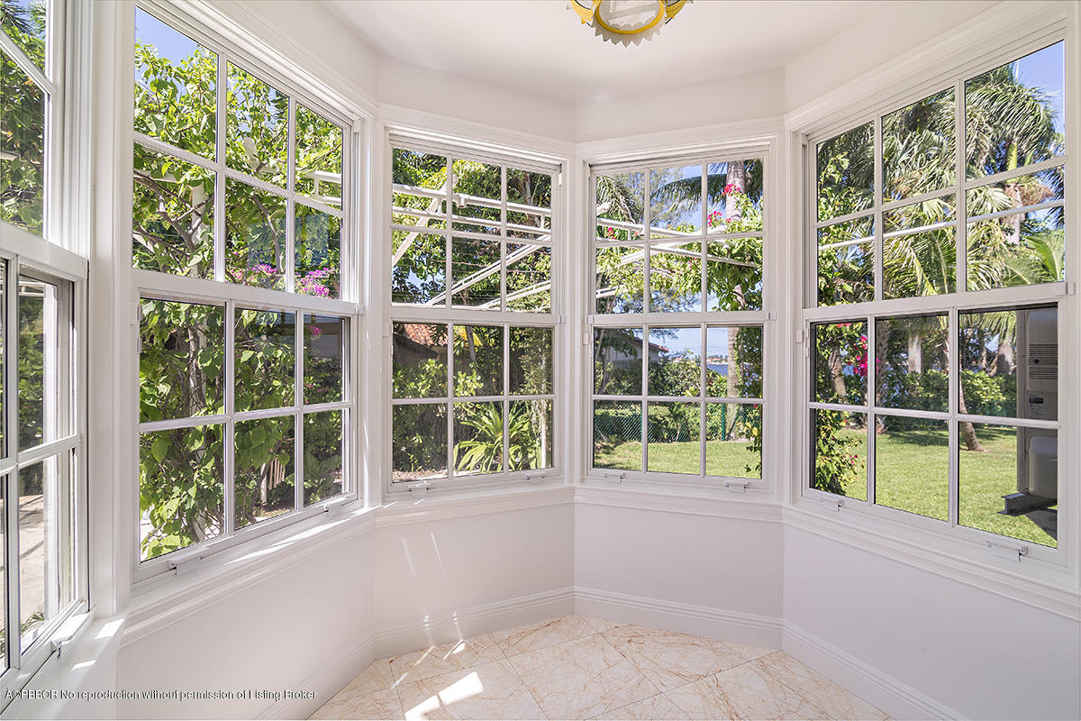 3130 Washington Road West Palm Beach, FL 33405 - Photo 11 of 33 front view of a brick house with large windows